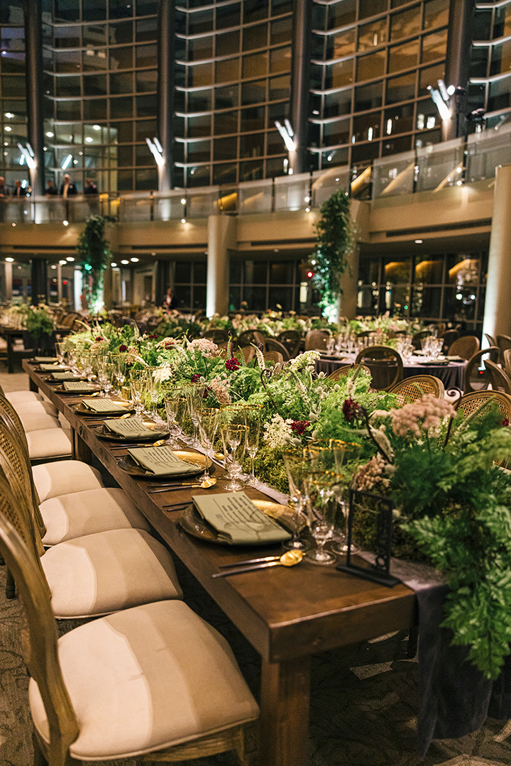 brown table layout with green floral setup