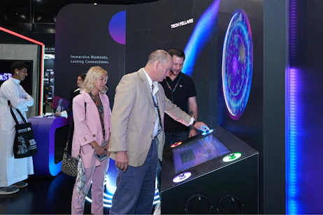 Visitors engaging with an immersive AI-powered experience at SES 2025 in Riyadh