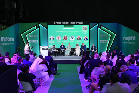 Exhibitors preparing product samples for display at SES 2025 in Riyadh