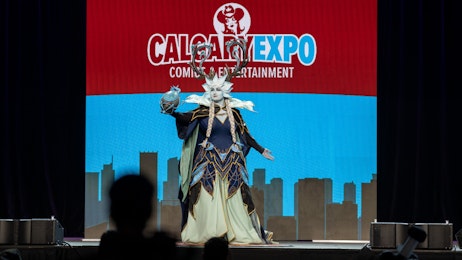 A cosplayer is on stage during the Cosplay Craftsmanship Cup at CALGARY EXPO 2023.