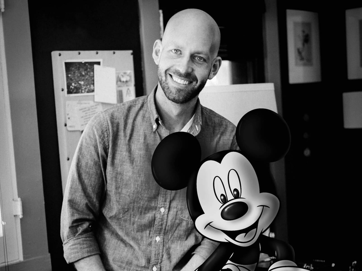 Bret Iwan posing with Mickey drawn on top