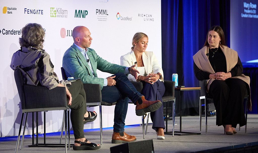 Speakers on stage at the multi-residential real estate event
