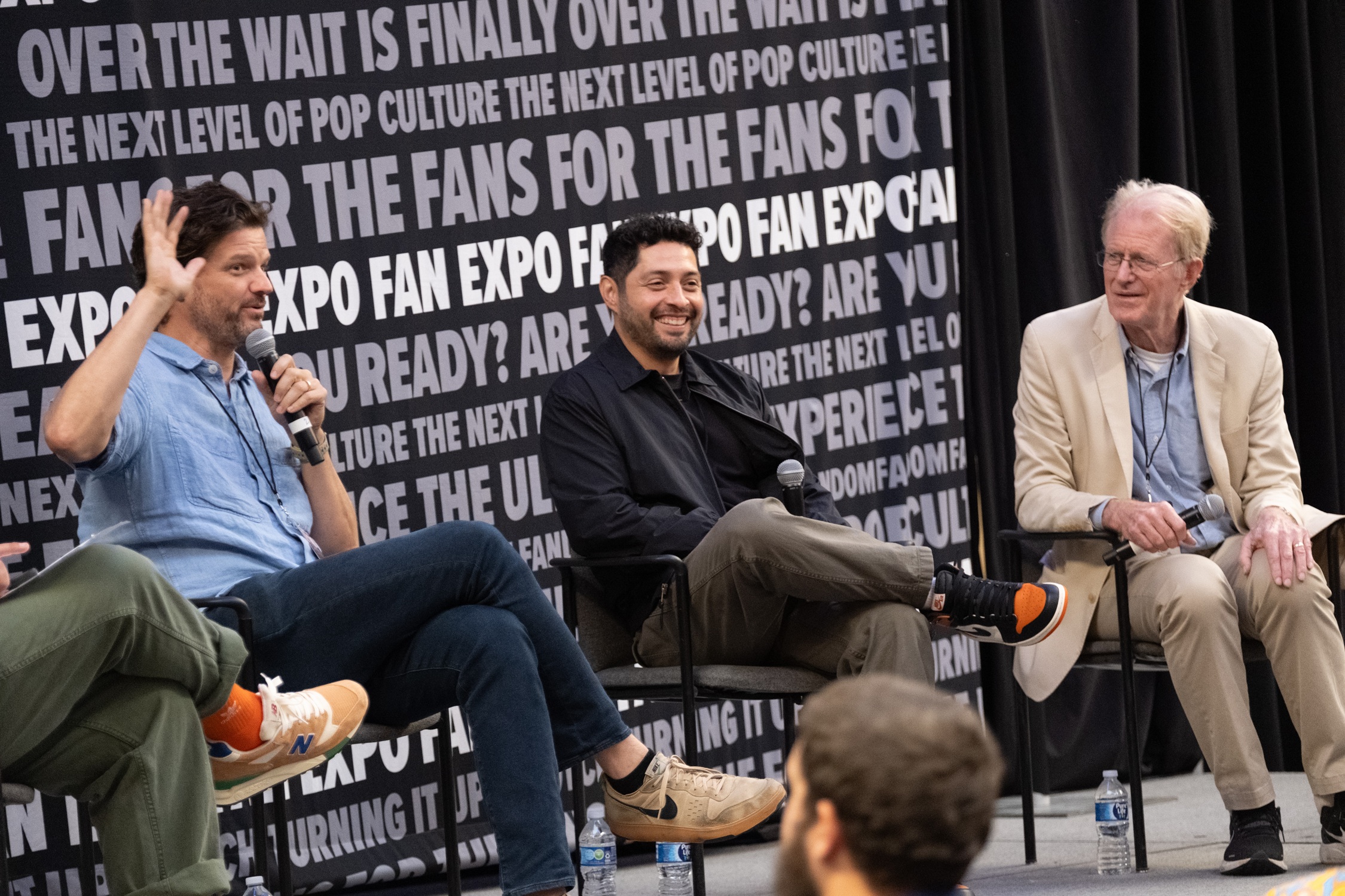 Actors Matt Jones, Max Arciniega, and Ed Begley Jr. share laughs on stage during a Breaking Bad and Better Call Saul panel at Dallas FAN FESTIVAL.