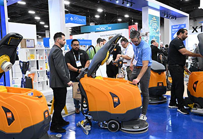 Attendees reviewing product