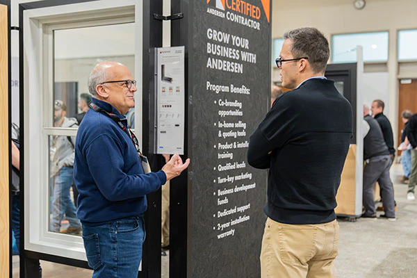 exhibitor having conversation with attendee