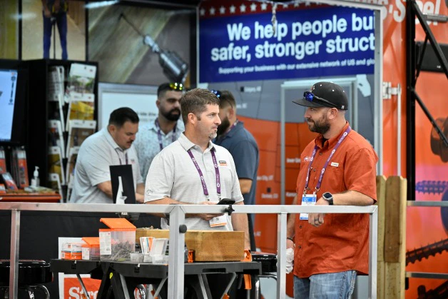 Decking pros looking at deck building products at Deck Expo