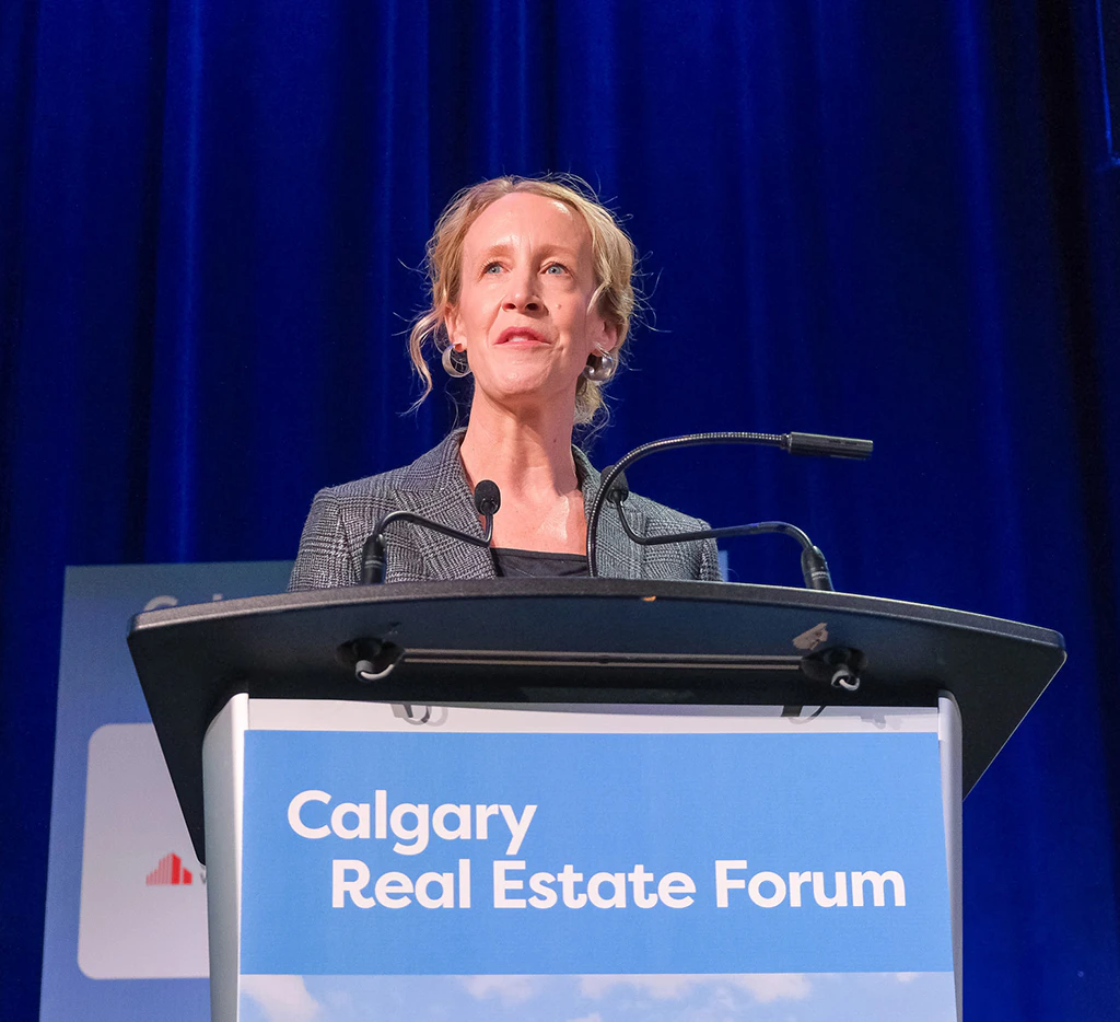 Speaker on stage at Calgary Real Estate Forum