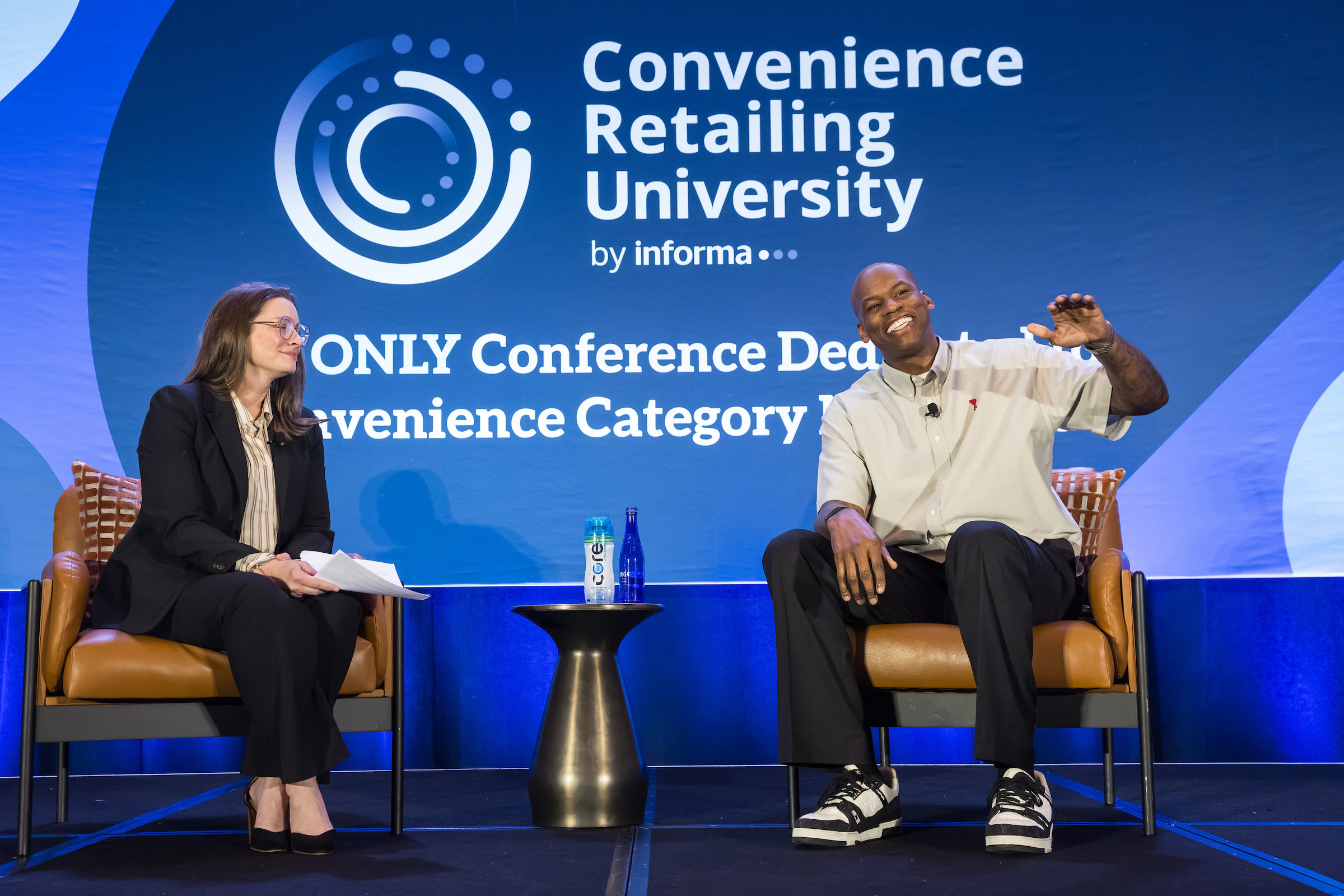 Image of two speakers on the general session stage at the 2026 CRU conference.