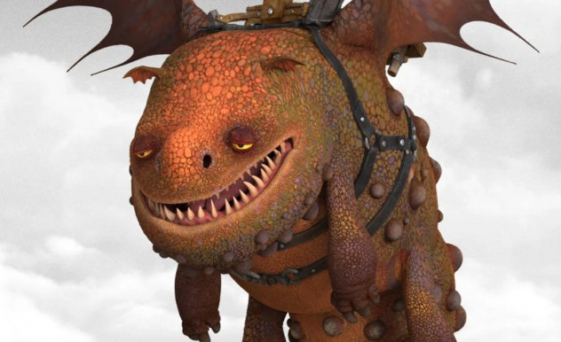 An orange and brown dragon, with a round face and and rounded features, wears a black saddle and flies through grey clouds.