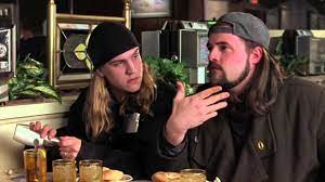 Jay and Silent Bob in a diner. Jay is looking at Silent bob as he pour sugar/salt on his food. Silent Bob is in the middle of his big monologue in the movie.