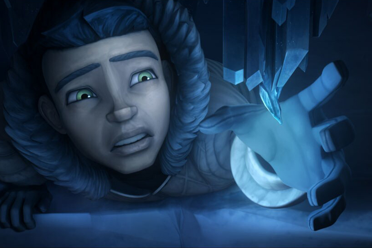 A child in a hooded coat lays on the ground, arm extending towards a glowing blue crystals hanging off a sheet of ice