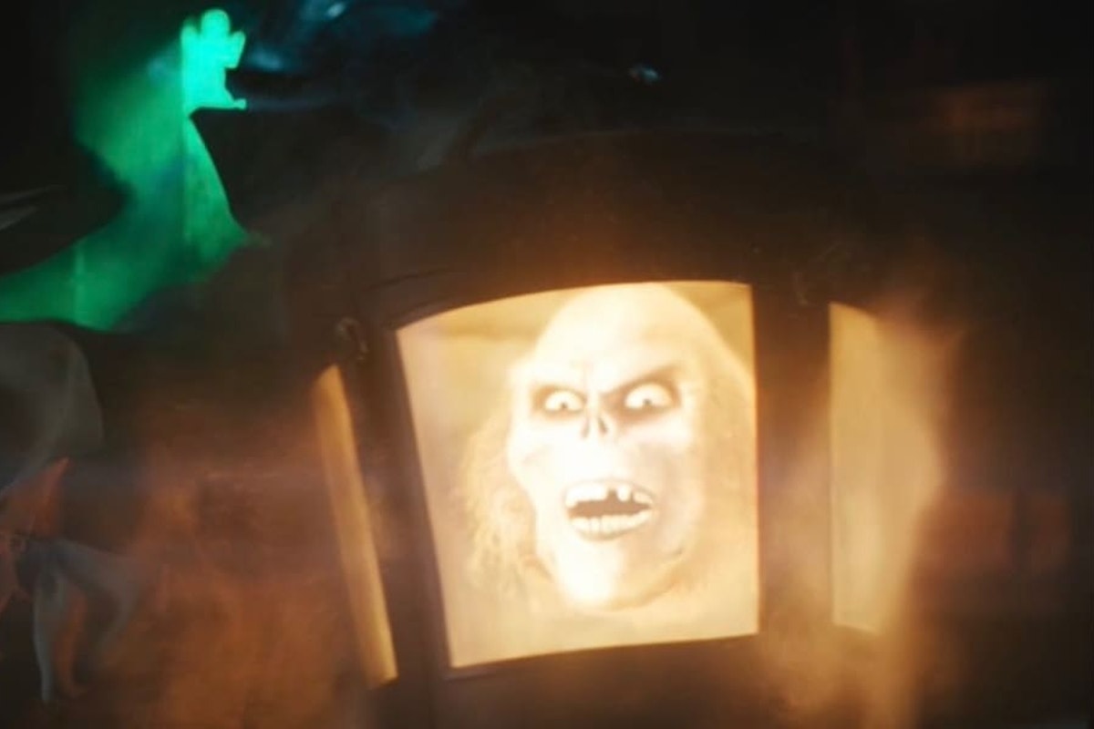 A disembodied head floats in a hat case