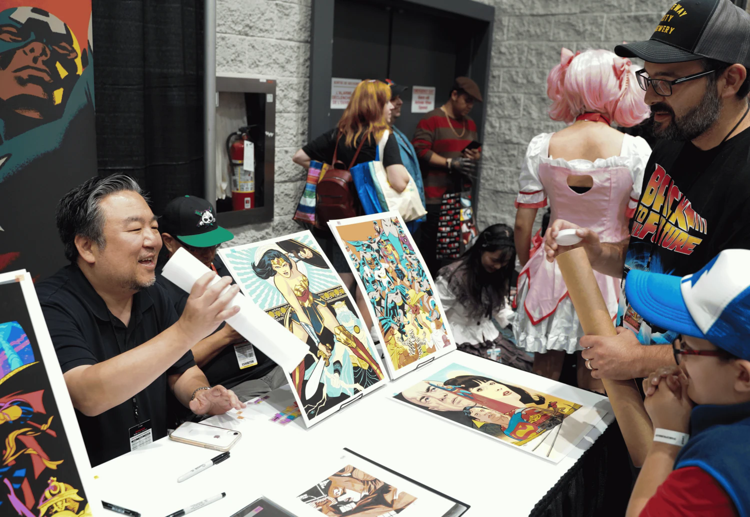 A comic artist works on their artwork at FAN EXPO Canada