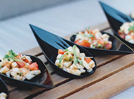 fish on black tasting spoons