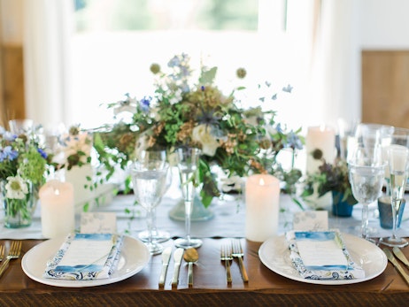 wood table with blue and white plate decorations