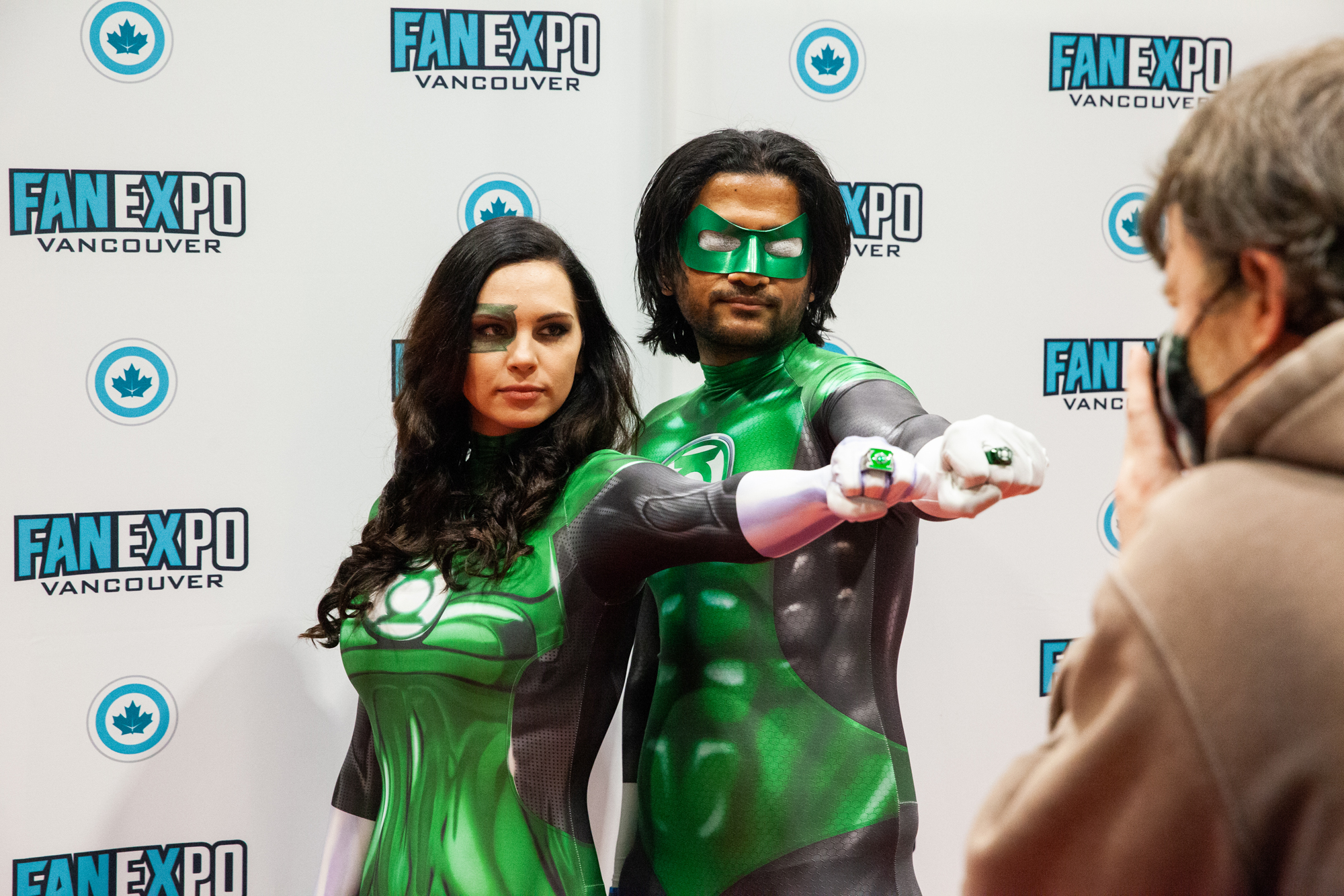 A pair of cosplayers dressed up as Green Lantern Corps members, posing at the Cosplay Red Carpet.