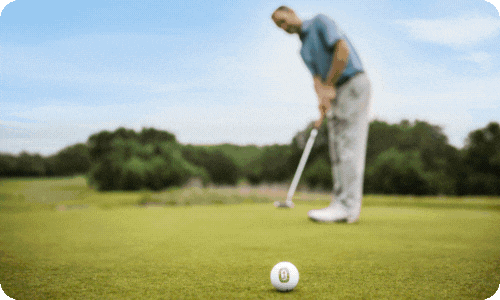 Golfer on putting green