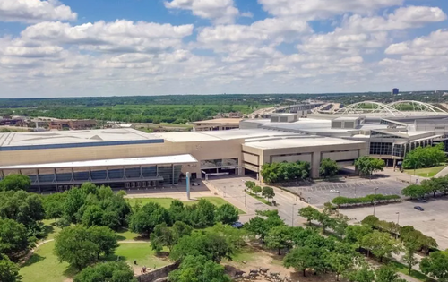 Photo of the outside of the Kay Bailey Hutchison Convention Center on a sunny day