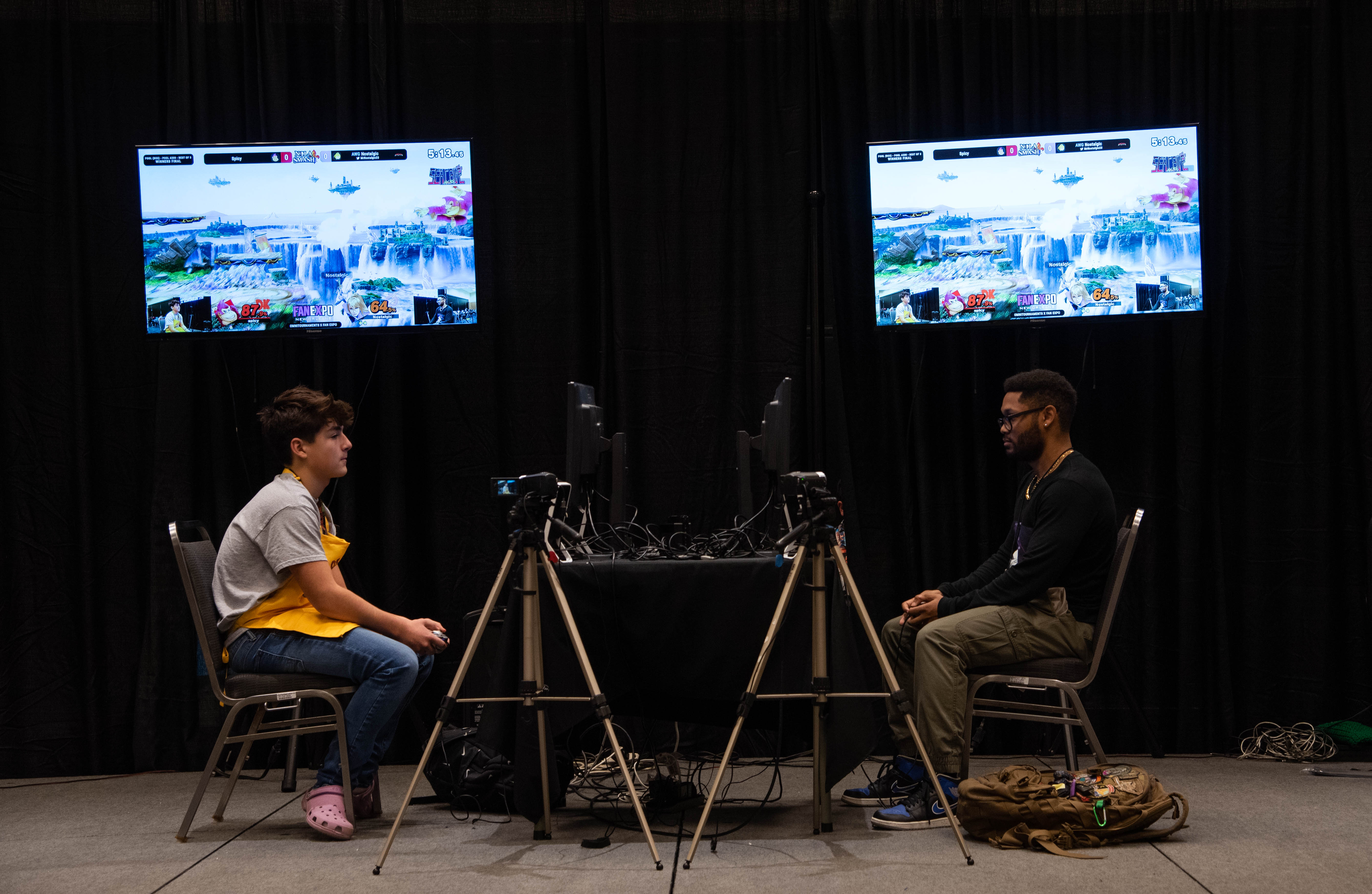 Two people competing in one of the Smash tournaments held at FAN EXPO New Orleans.