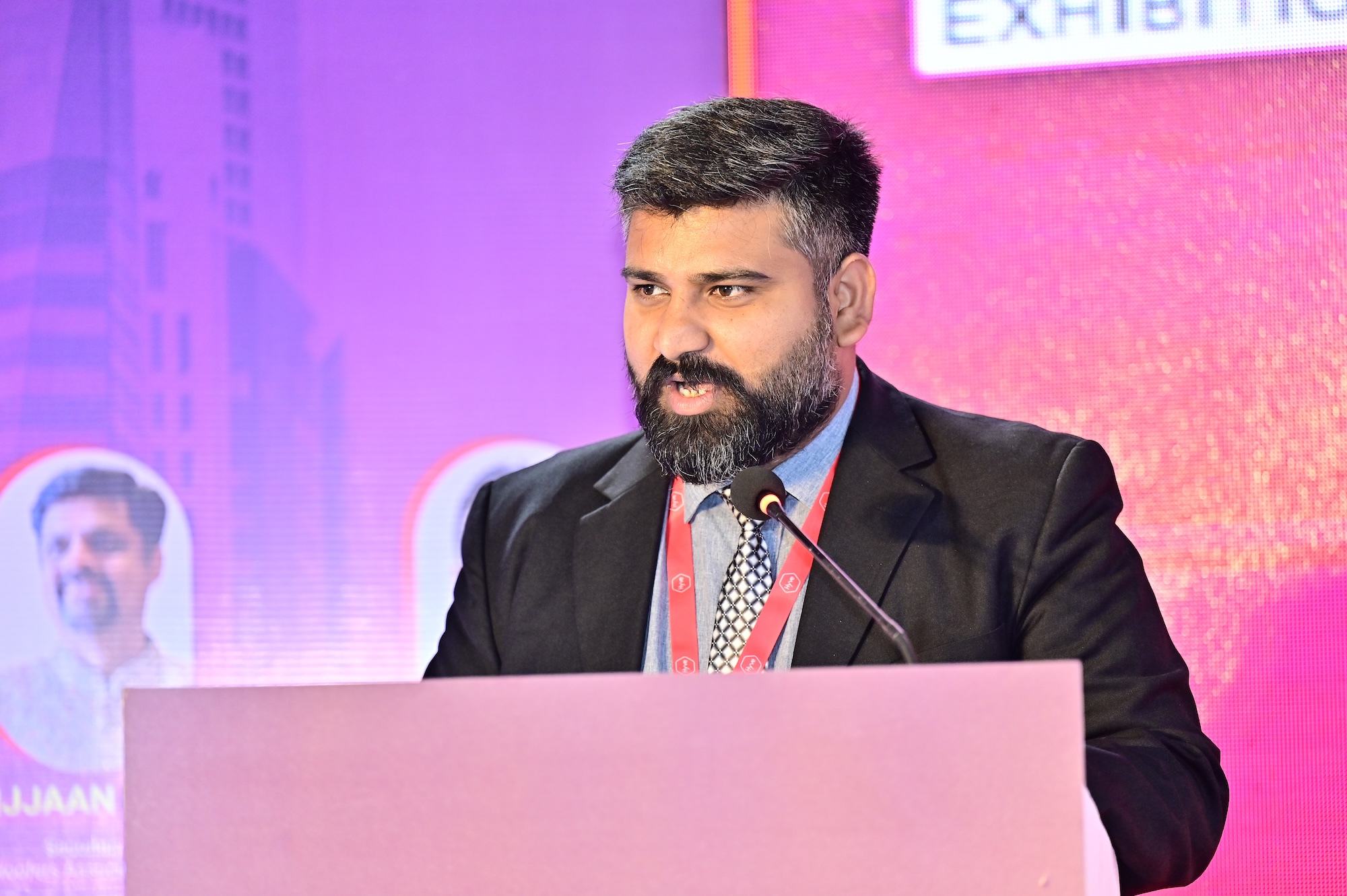 Speaker giving a presentation on stage