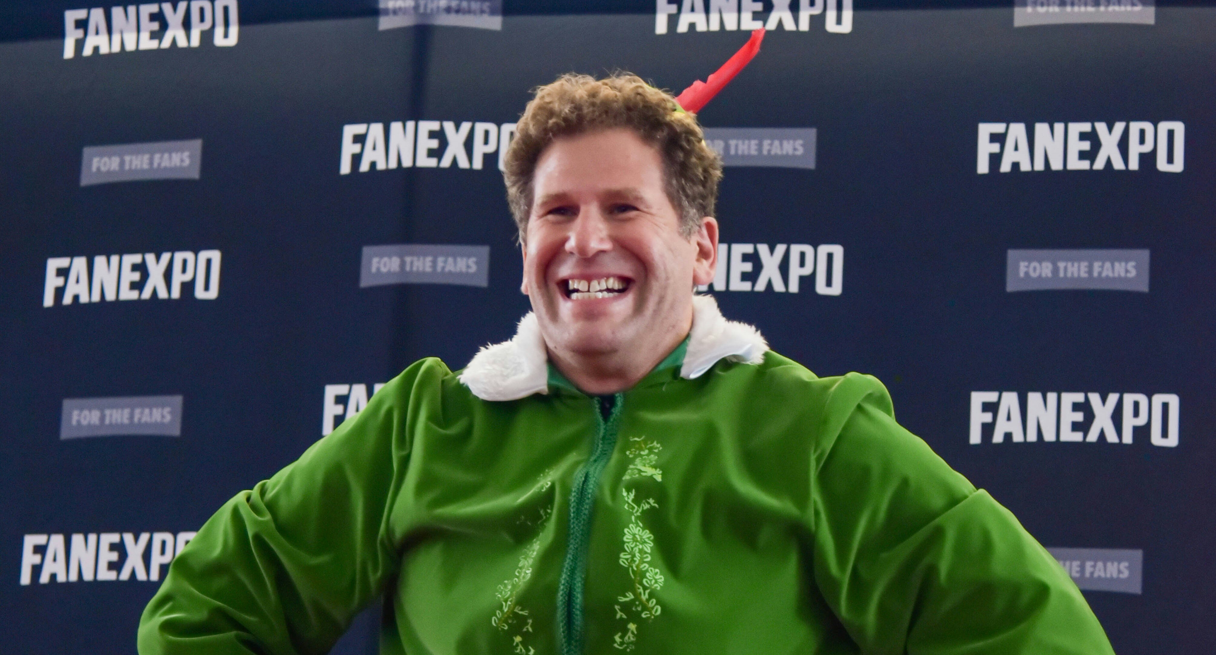 A cosplayer dressed up as the Buddy the Elf from the Christmas movie, Elf.