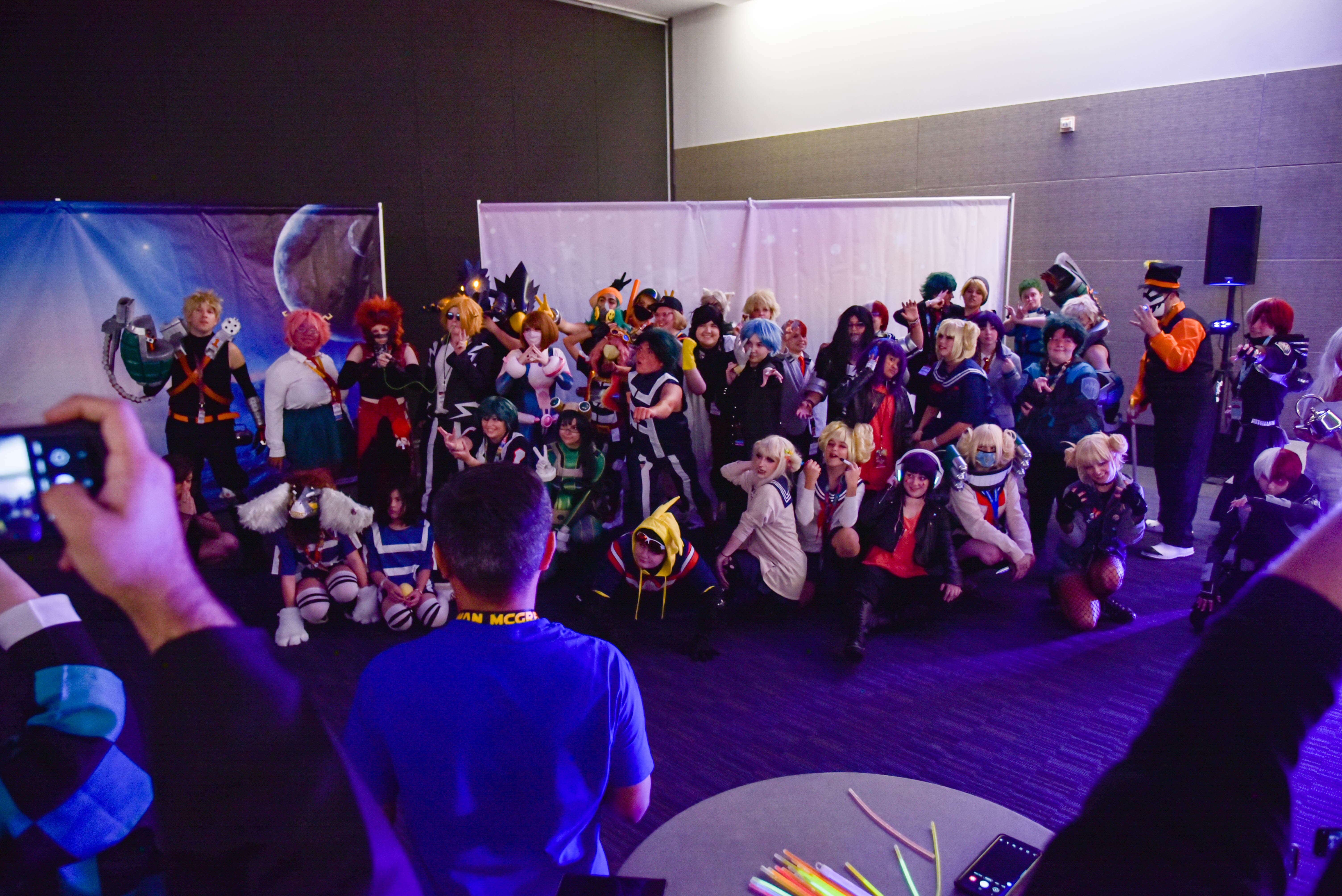 A massive group of cosplayers dressed up as a variety of characters from the anime, My Hero Academia.