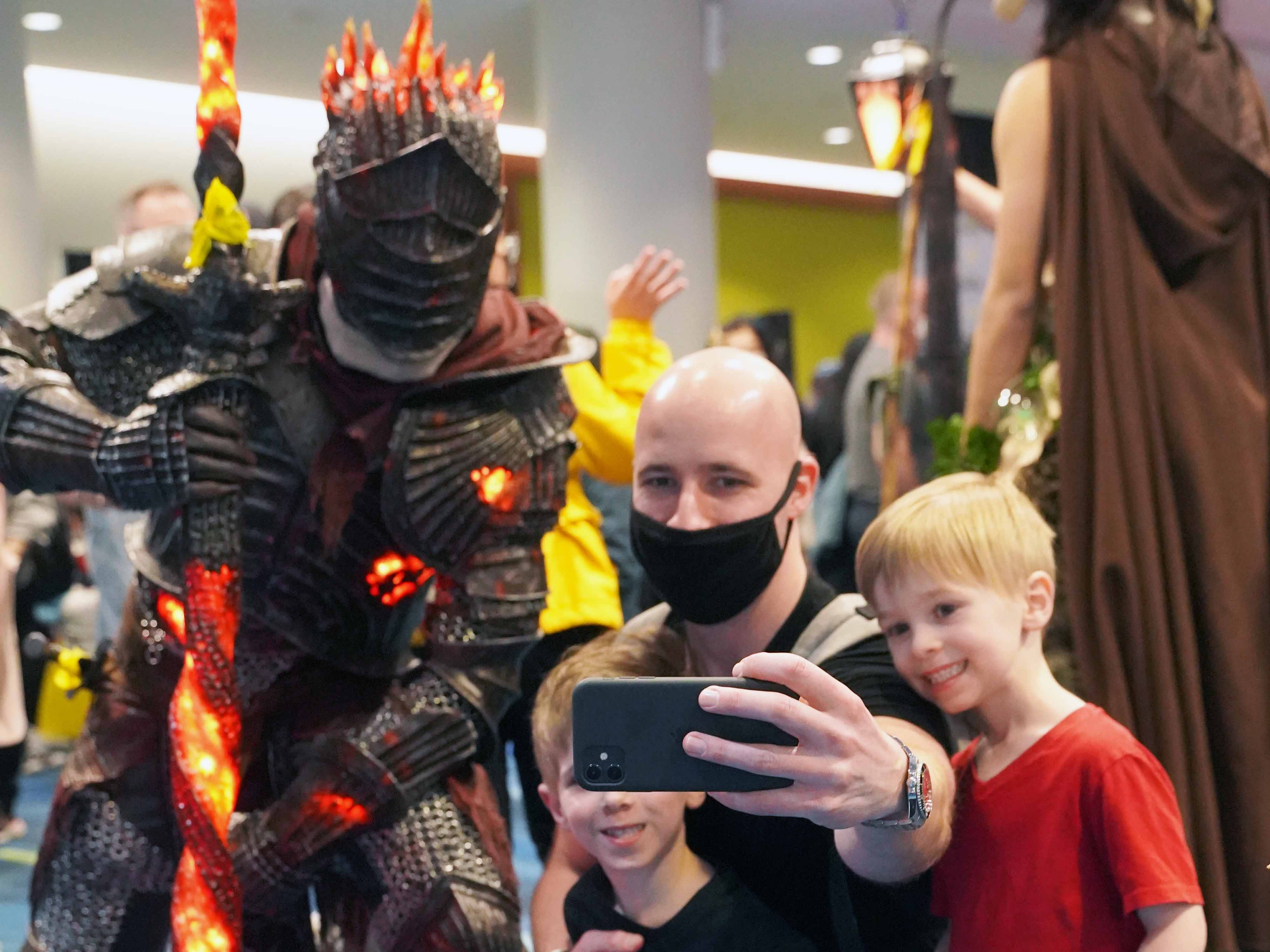 Man taking selfie with a Cosplayer