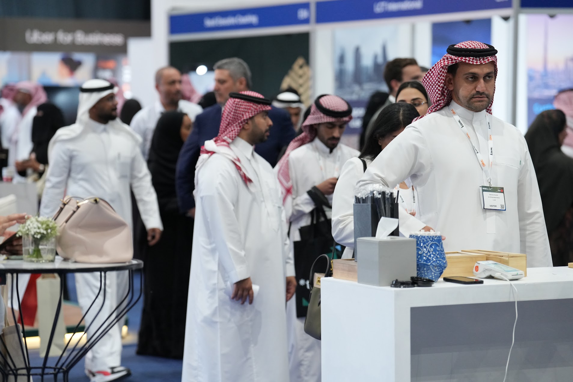 Professionals networking at HRSE Summit with various booths