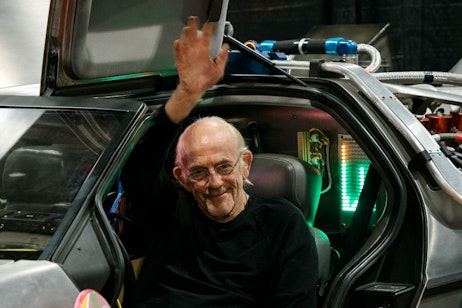 Christopher Lloyd in the DeLorean waving
