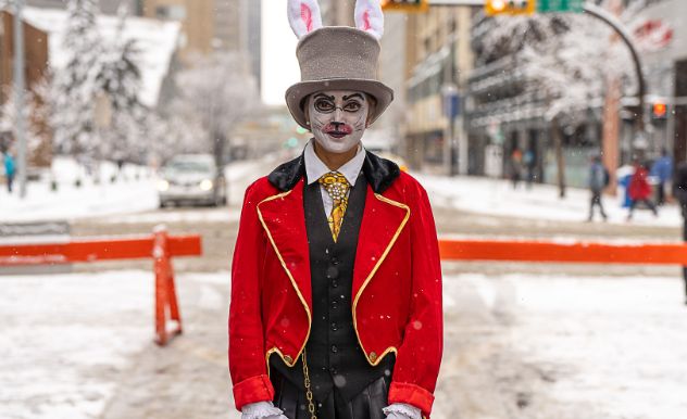 calgary mayor in white rabbit cosplay stands in the middle of the street