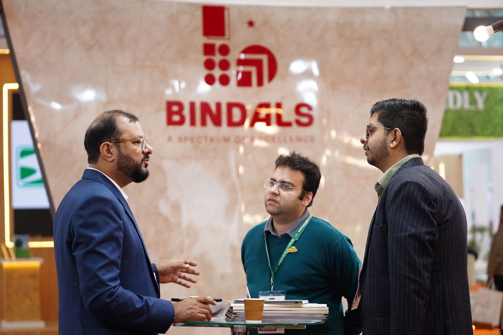 Prakash company booth at a trade show with visitors examining displays