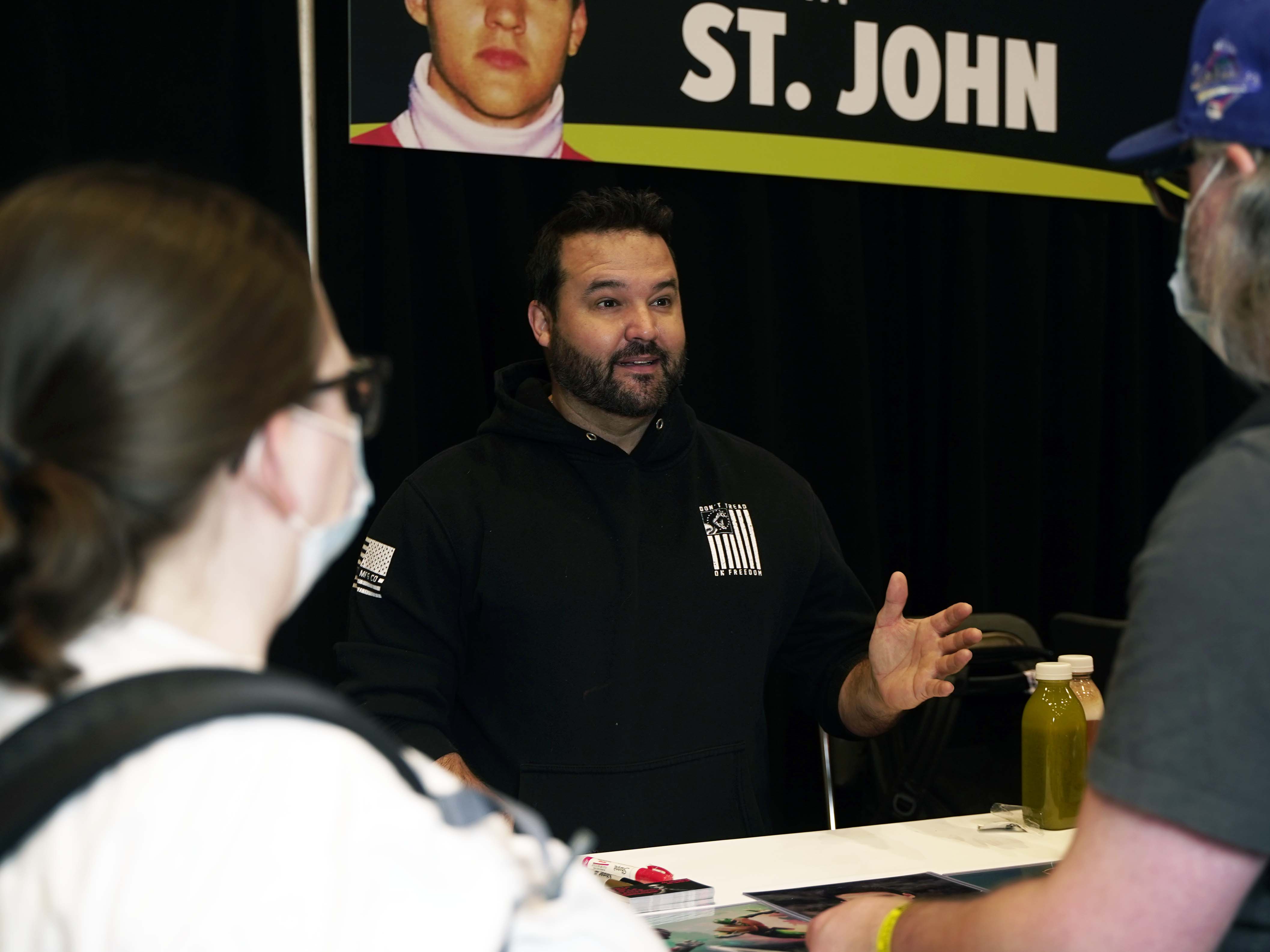 AUSTIN ST. JOHN interacting with fans at his autograph table