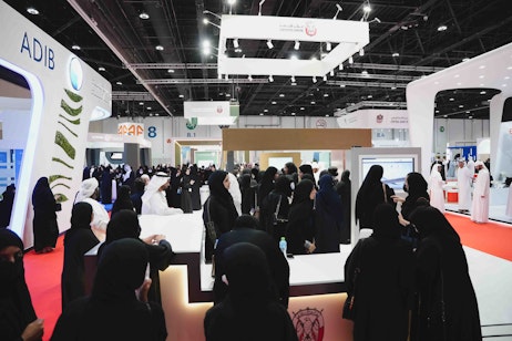 Emirati professionals networking with employers across multiple sectors at Tawdheef x Zaheb 2025 career exhibition in Abu Dhabi.