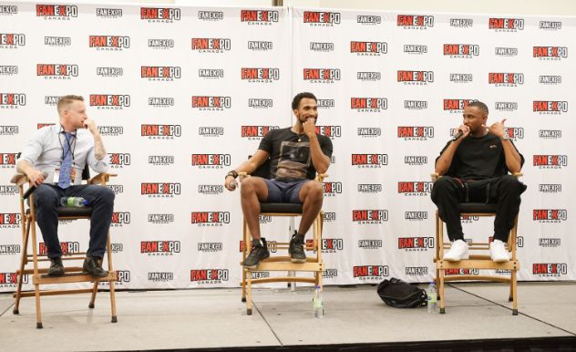 Nathan Mitchell and Jessie Usher sit next to each other on stage at FAN EXPO Canada for their panel