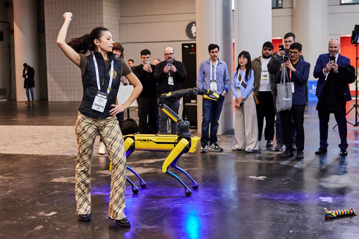 Dancer with a dog robot at The AI Summit New York