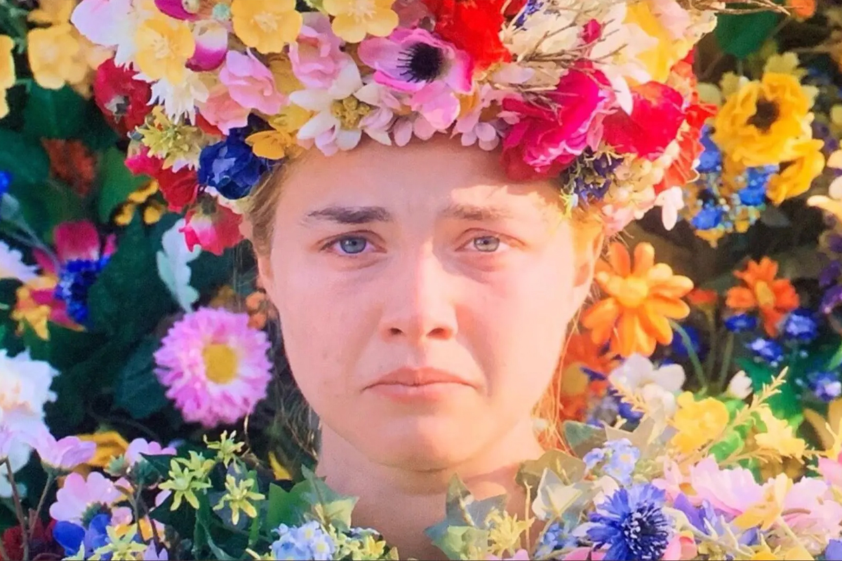 Dani from MidSommar looks unhappy in her flower crown & flower gown