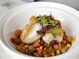 vegetable bowl topped with fish