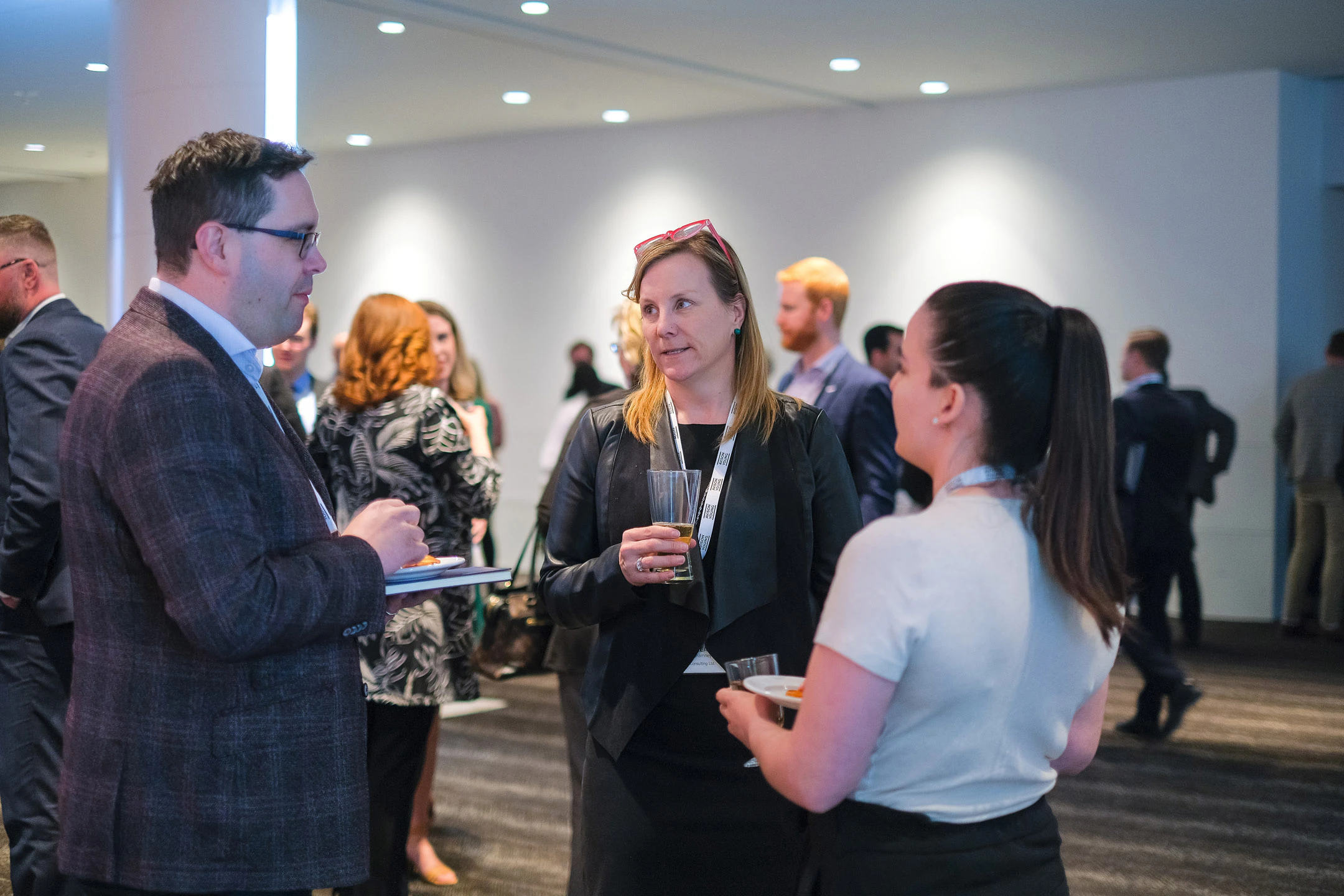 Calgary Real Estate Forum attendees engaged in conversation during a networking function