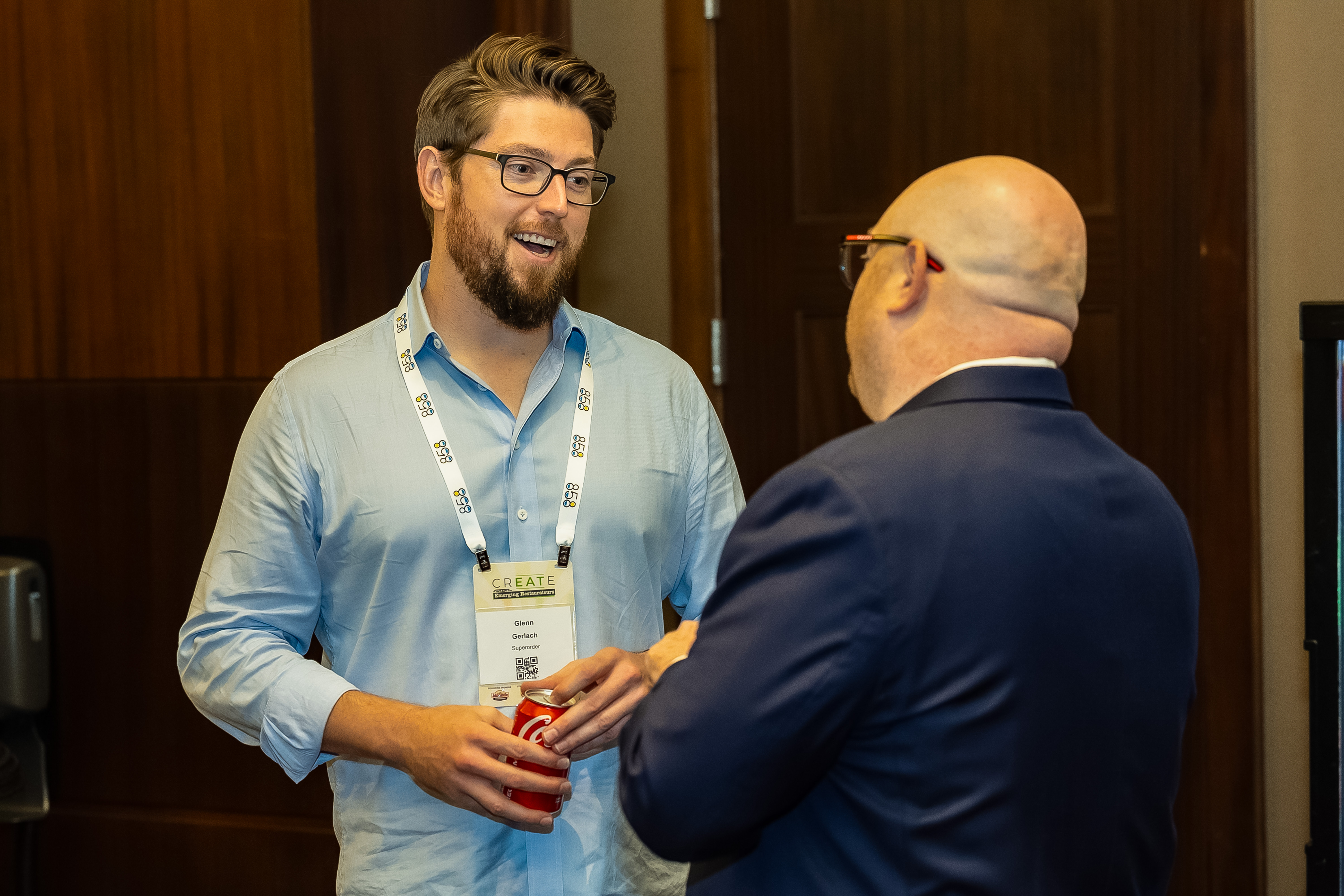 Two attendees conversing at CREATE 2024