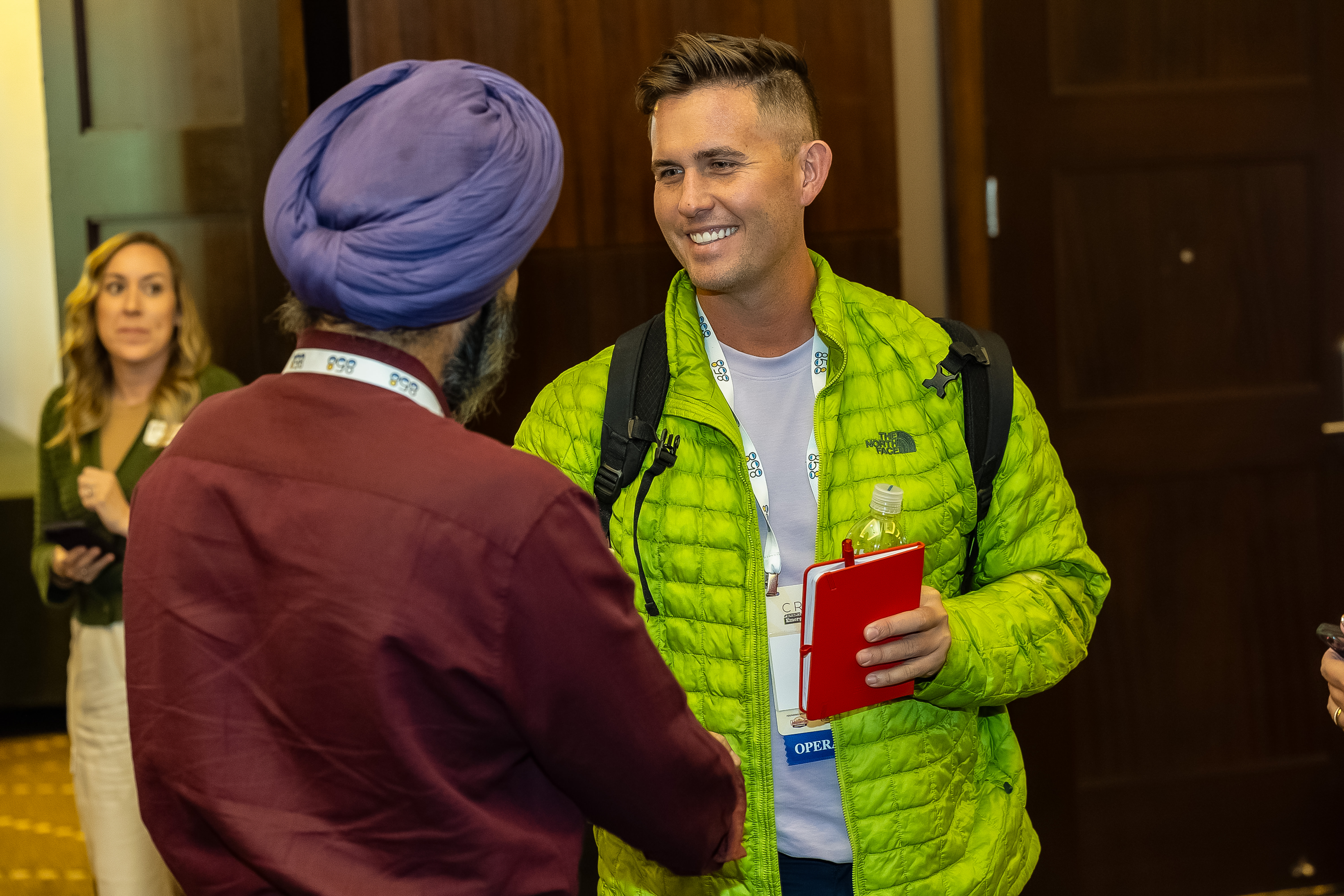 Two attendees conversing at CREATE 2024