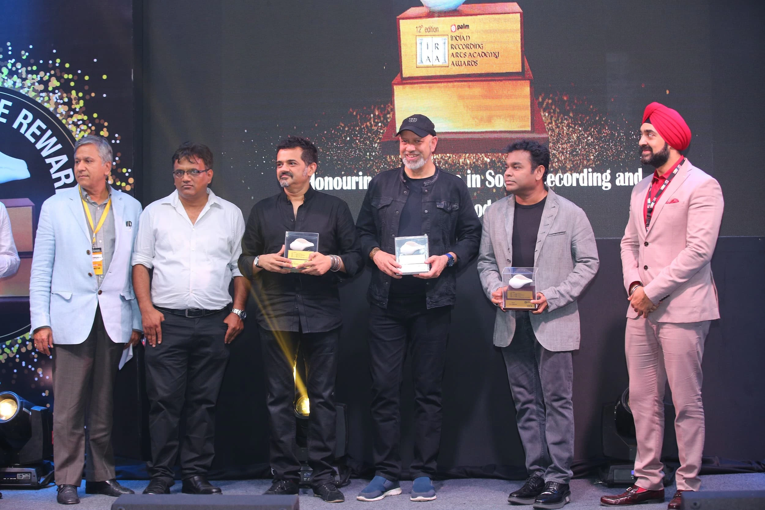 Ehsaan Noorani, Loy Mendonsa, and A.R. Rahman with the organizing committee