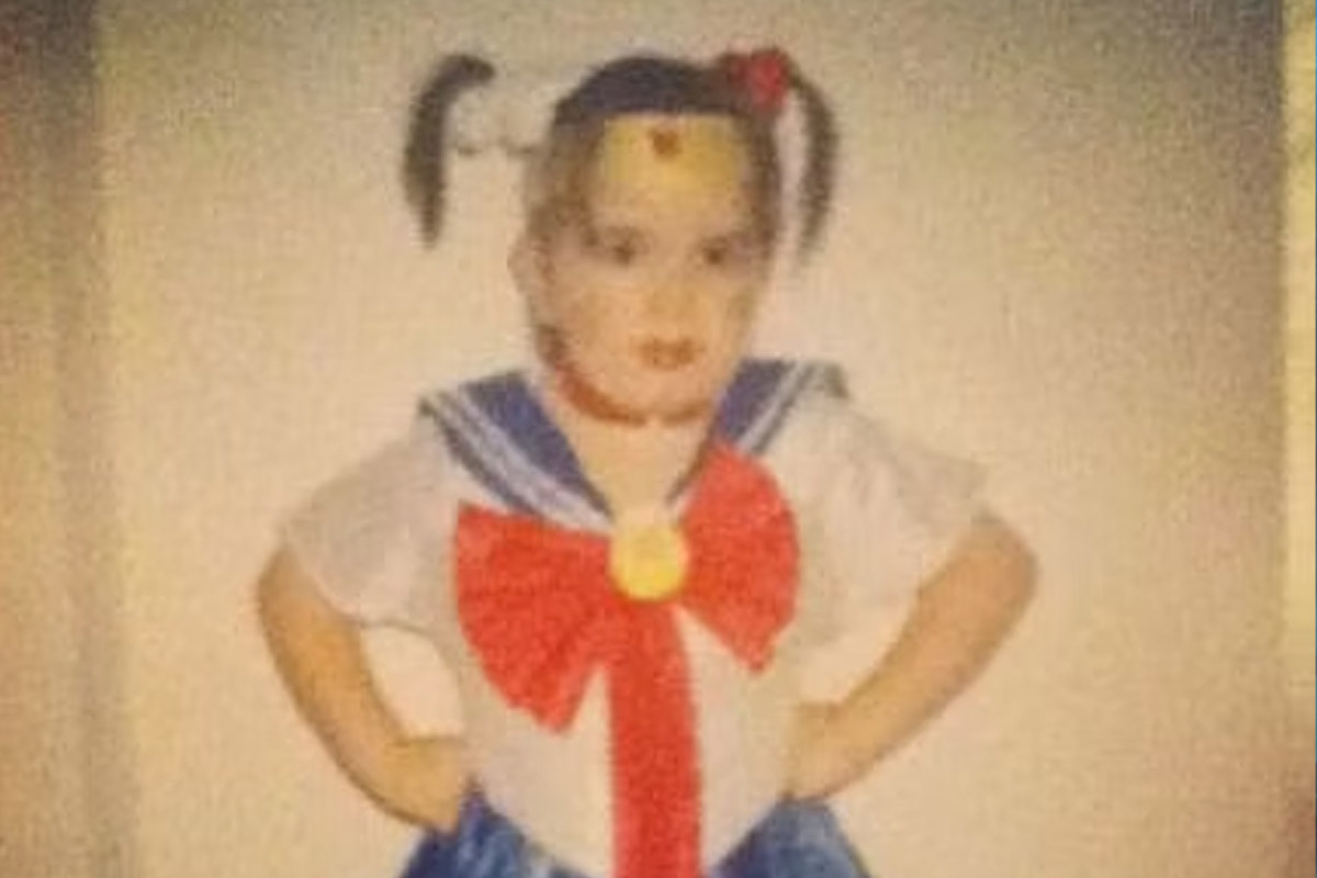 Emily Faustino stands in her Sailor Moon outfit as a child