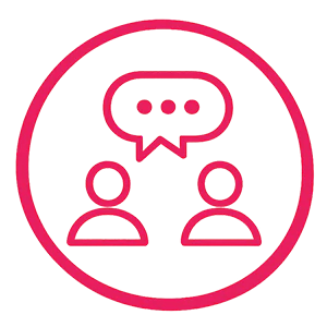 Coral icon of two people connected by a conversation bubble representing exclusive networking opportunities and professional connections.