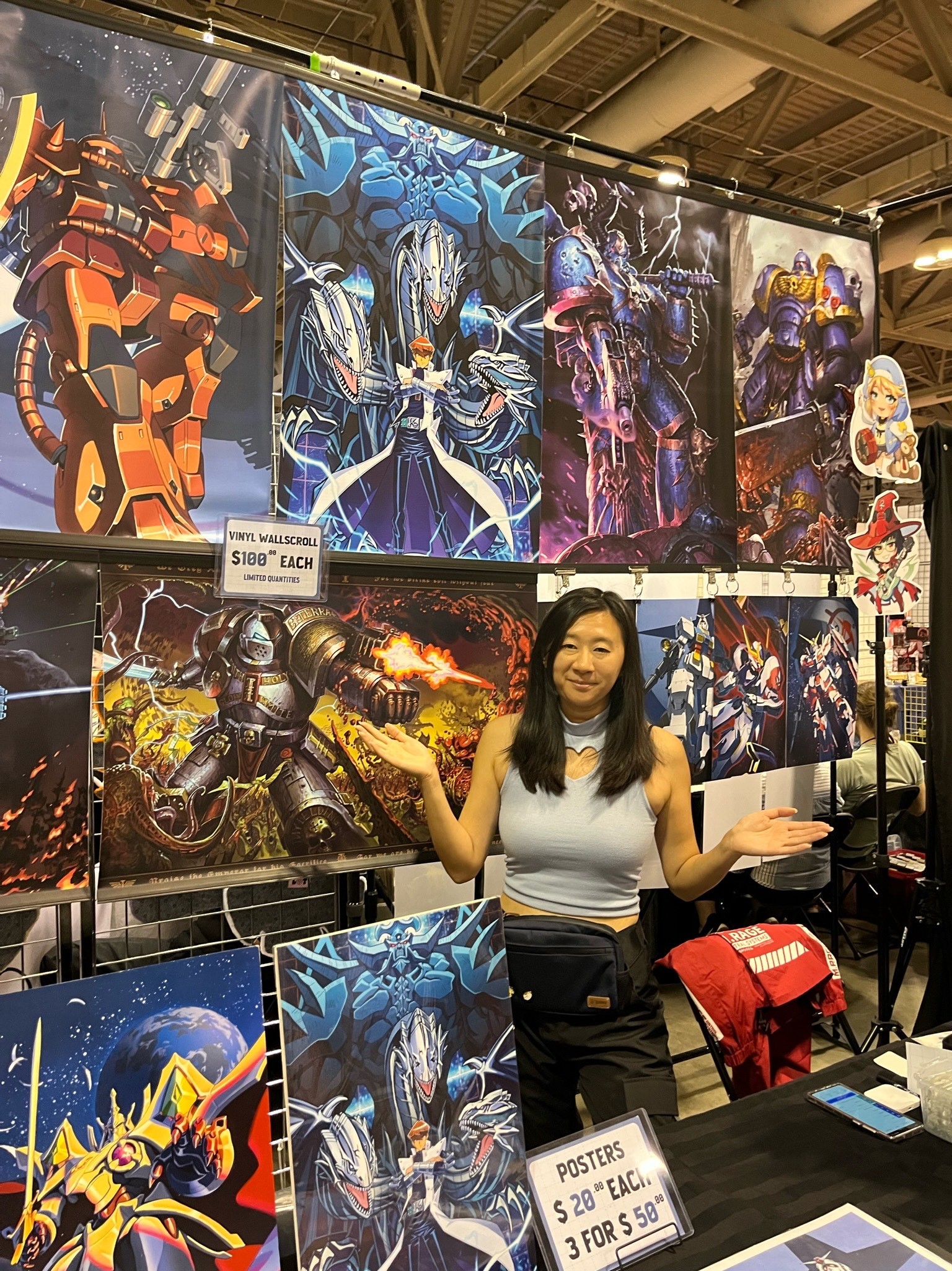 VENDOR POSES AT BOOTH