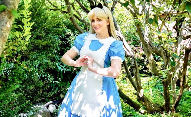 Maddie Rose poses in her cosplay as Alice in Wonderland