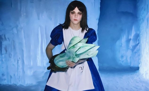 Maddie Rose cosplays in a blue and white dress with a black wig