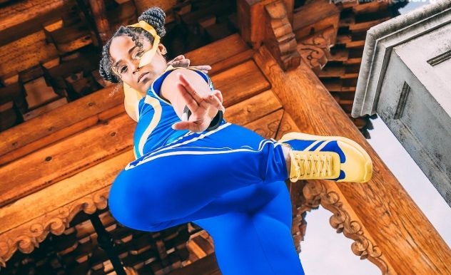 TIFFANY MZZSKITTLESTR in a blue outfit with gold shoes