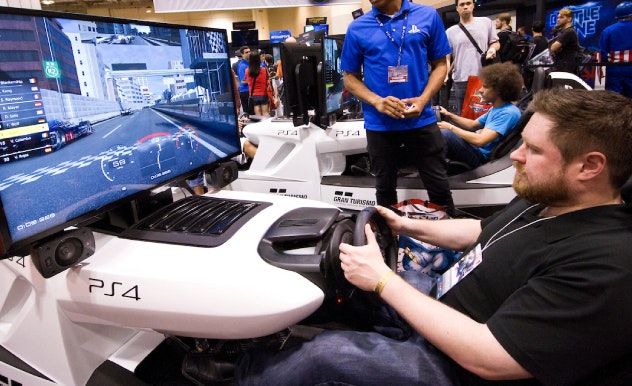 fan playing the playstation 4 at one of FAN EXPO Boston's gaming stations