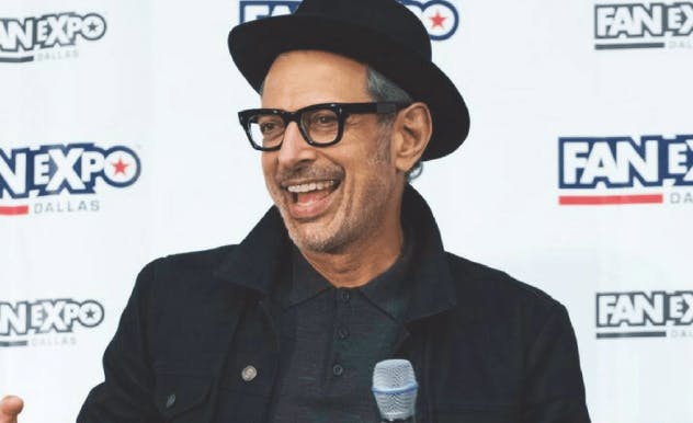 Jurassic Park actor Jeff Goldblum smiling and laughing at FAN EXPO Dallas guest panel