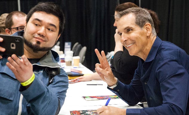 Jim Lee smiles on stage at MEGACON Orlando